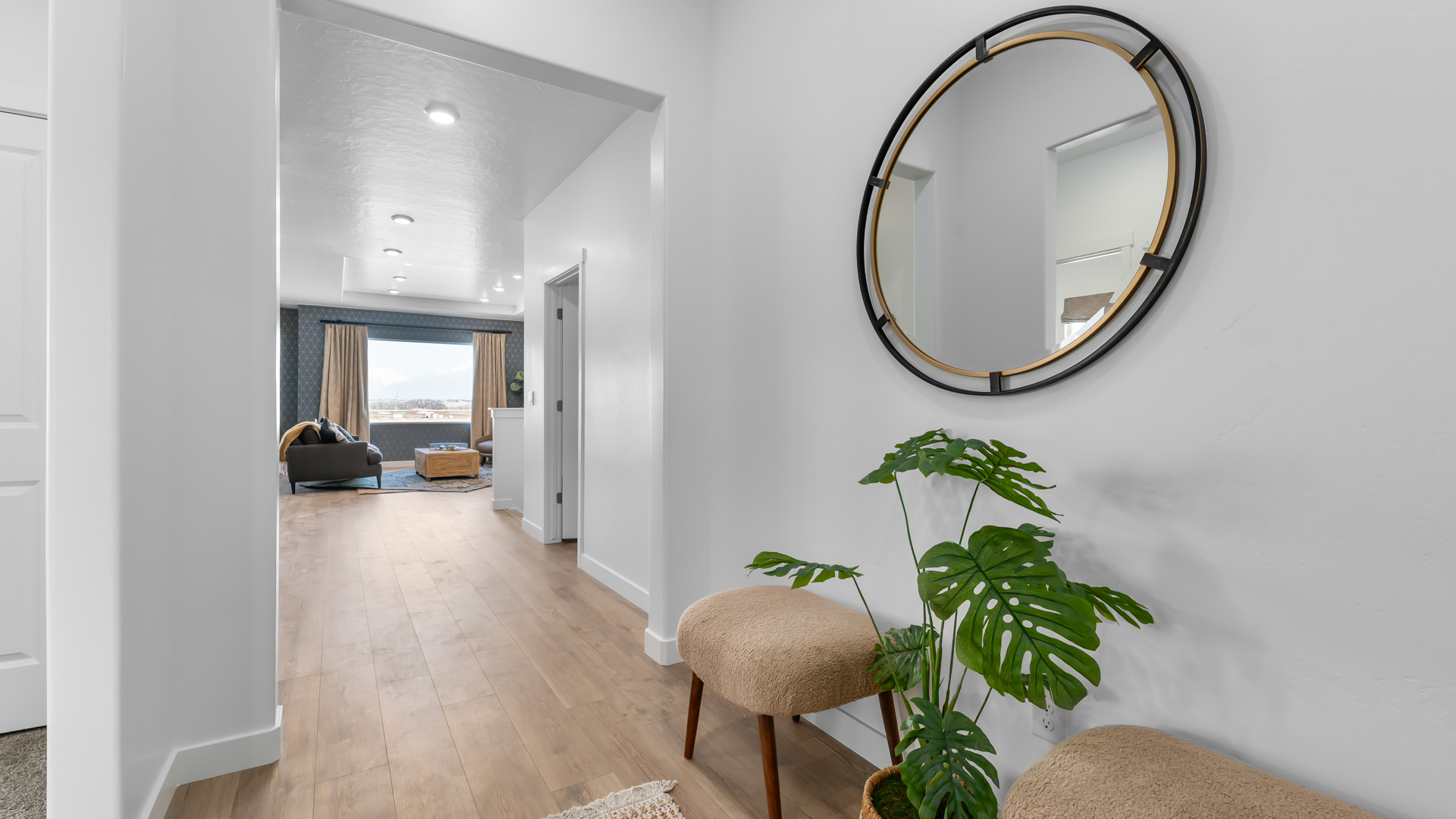 Spacious entryway into the home with view down the hallway and into the living room.
