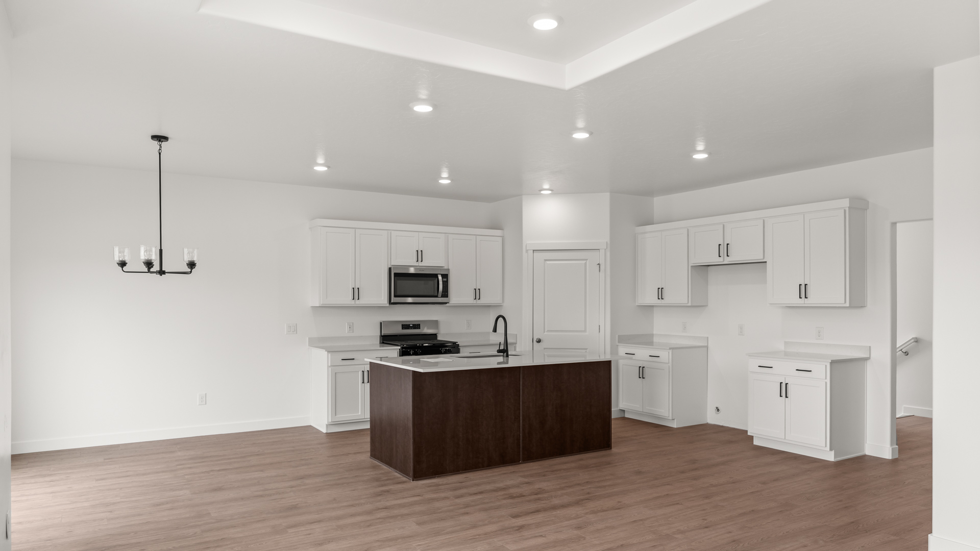Kitchen and dining space with kitchen island.