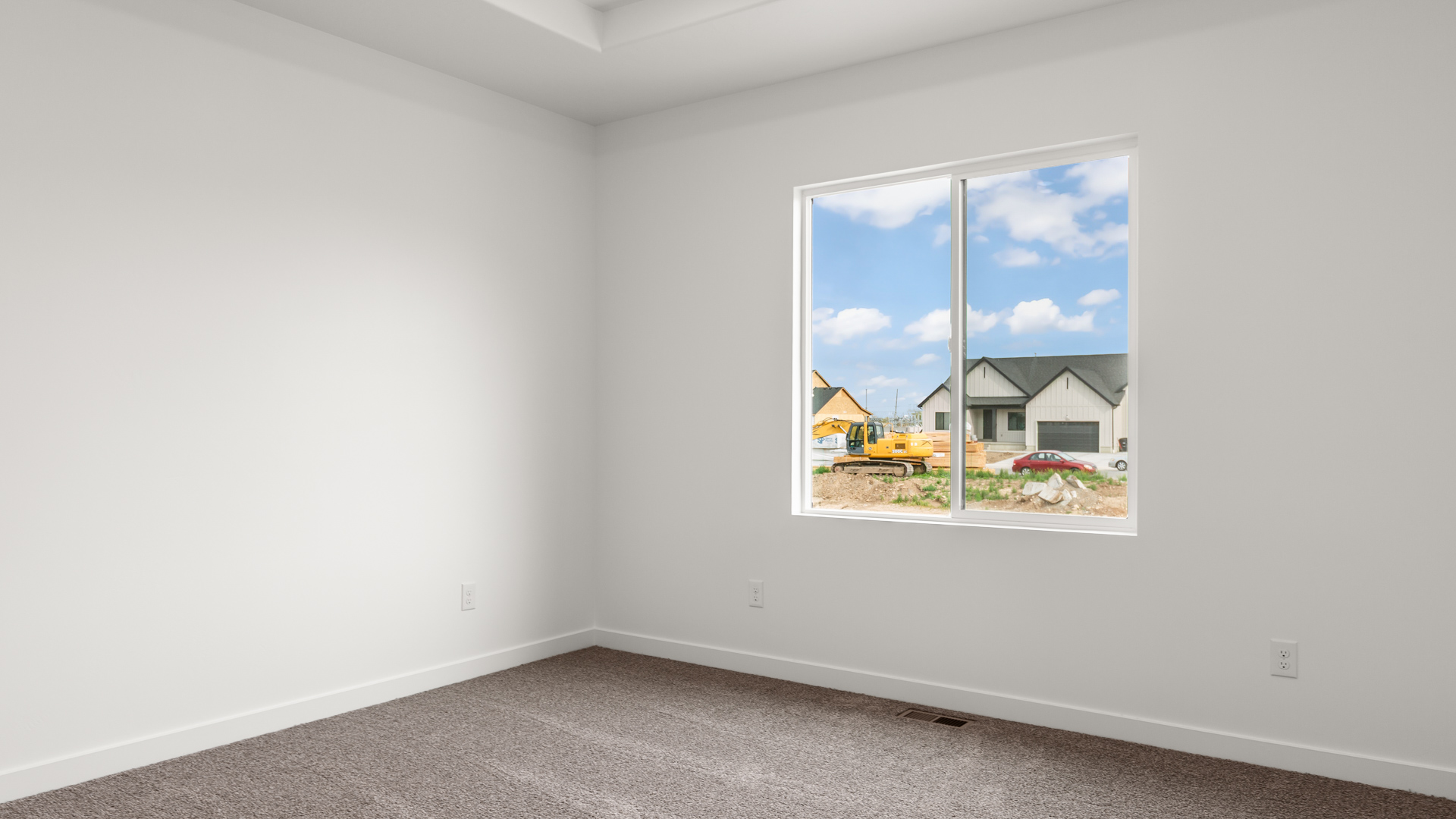 Primary bedroom with tray ceiling.