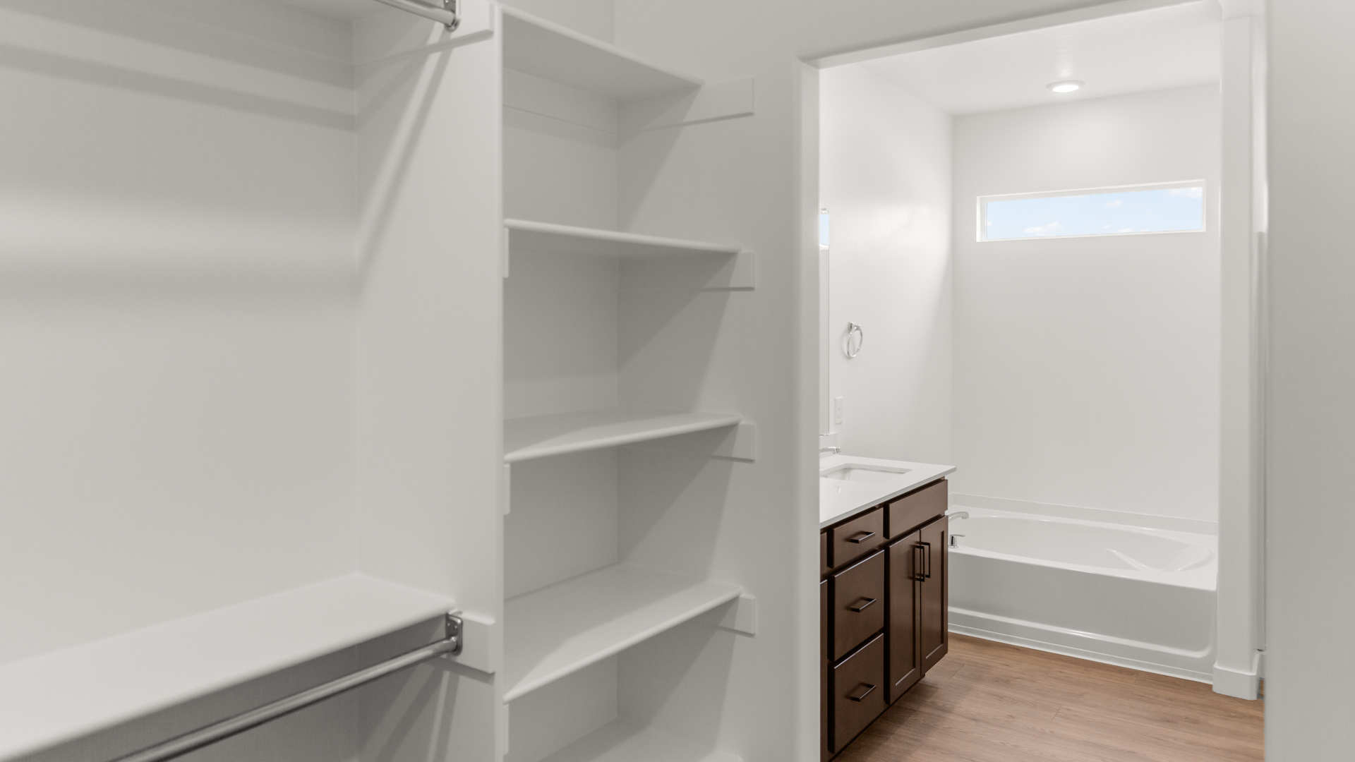 Walk-in closet into bathroom.
