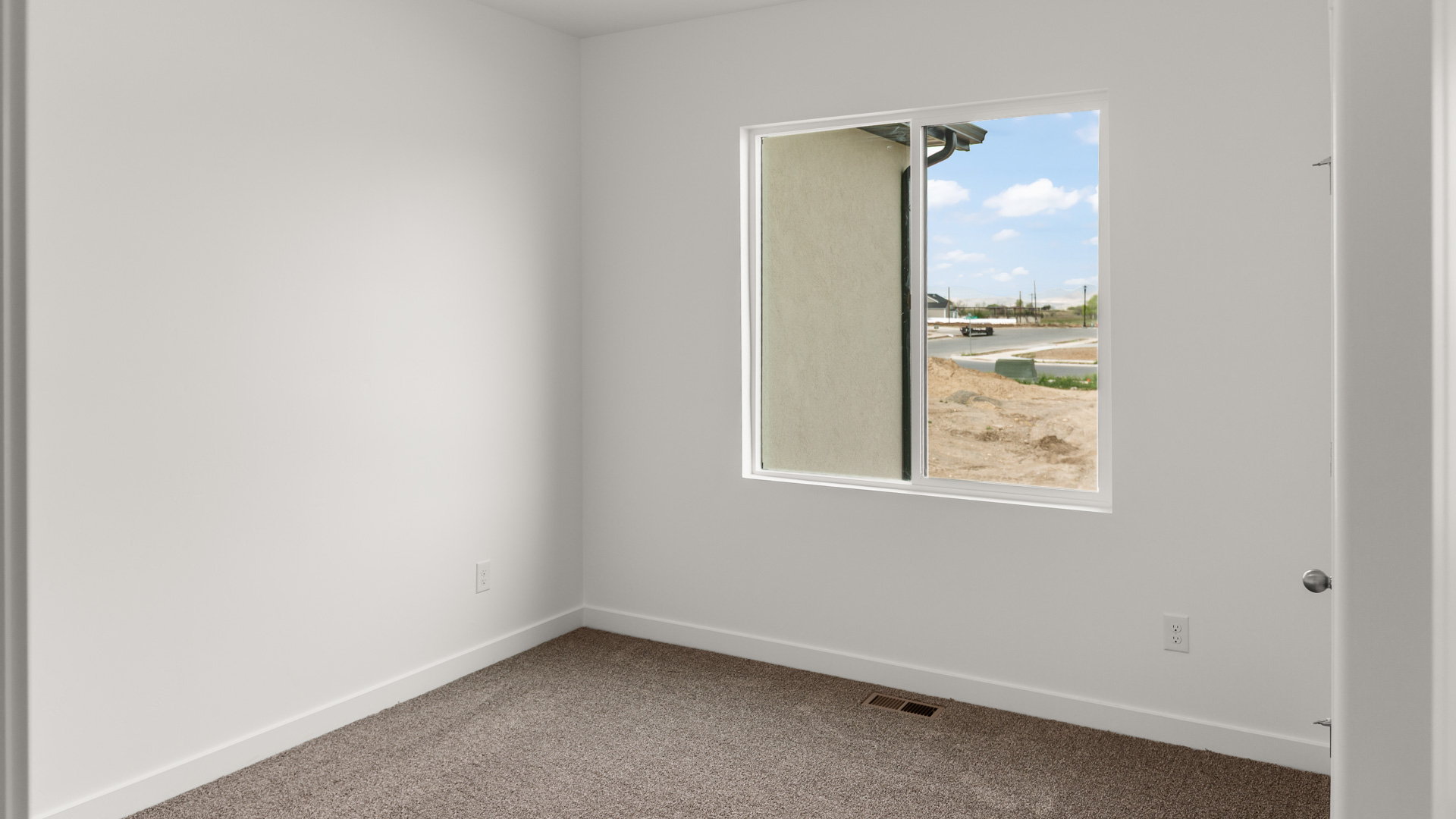 Bedroom with large window.