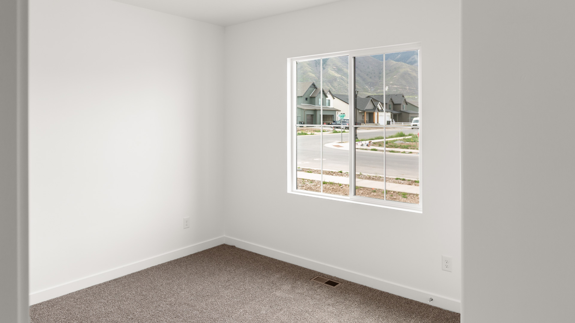 Bedroom with large window.