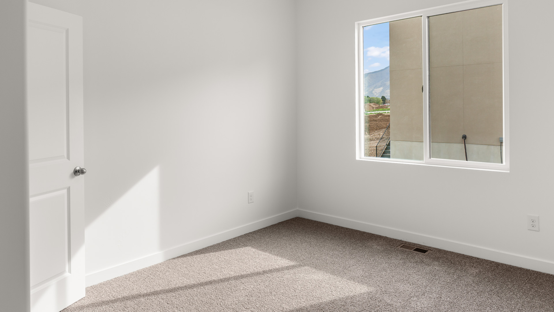 Bedroom with large window.