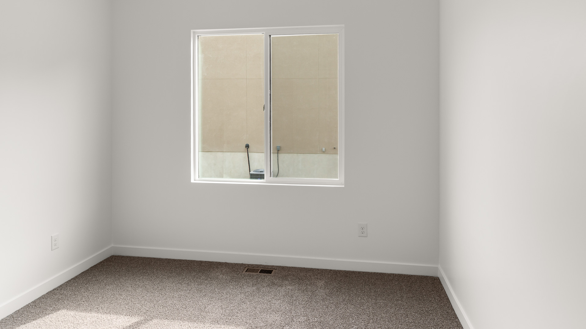 Bedroom with large window.