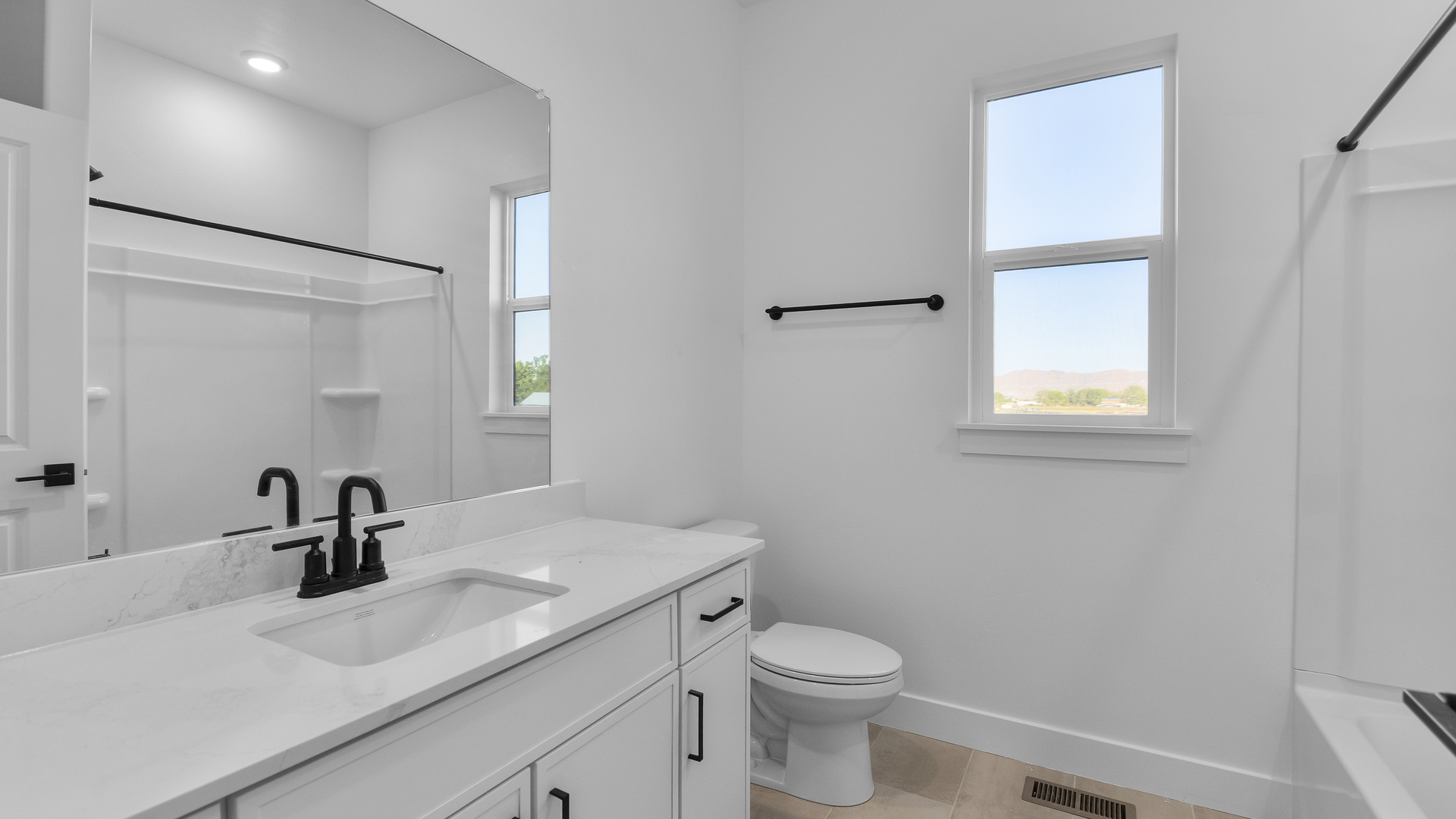 Bathrooms with vanity and shower surround