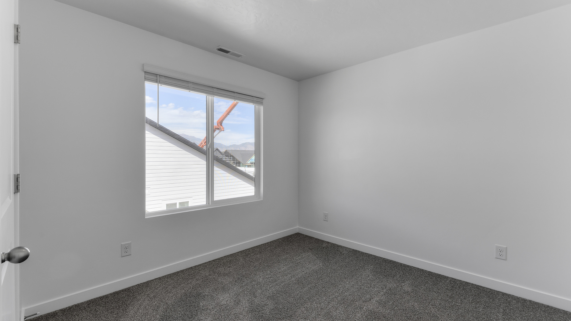 Bedroom with large window.