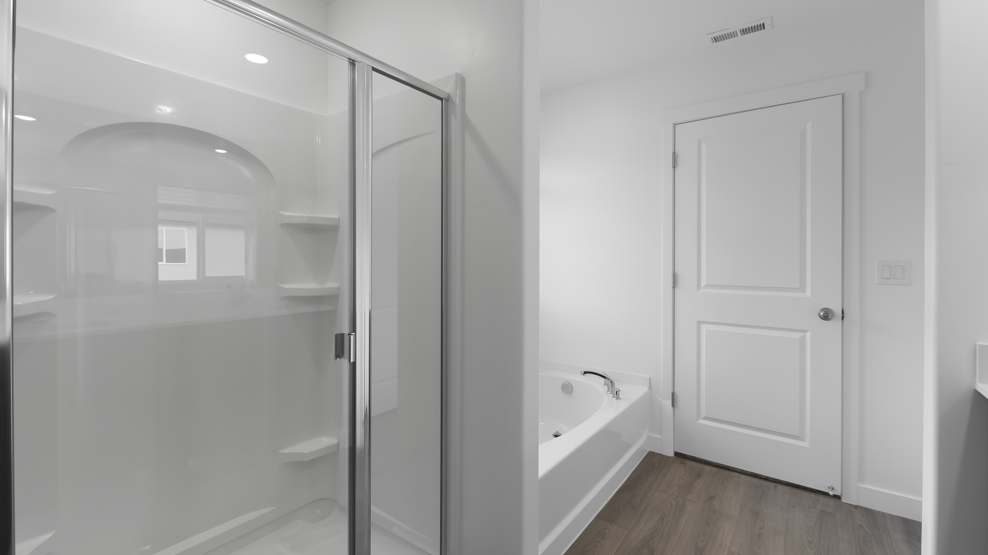 Primary bathroom with double sink vanity.