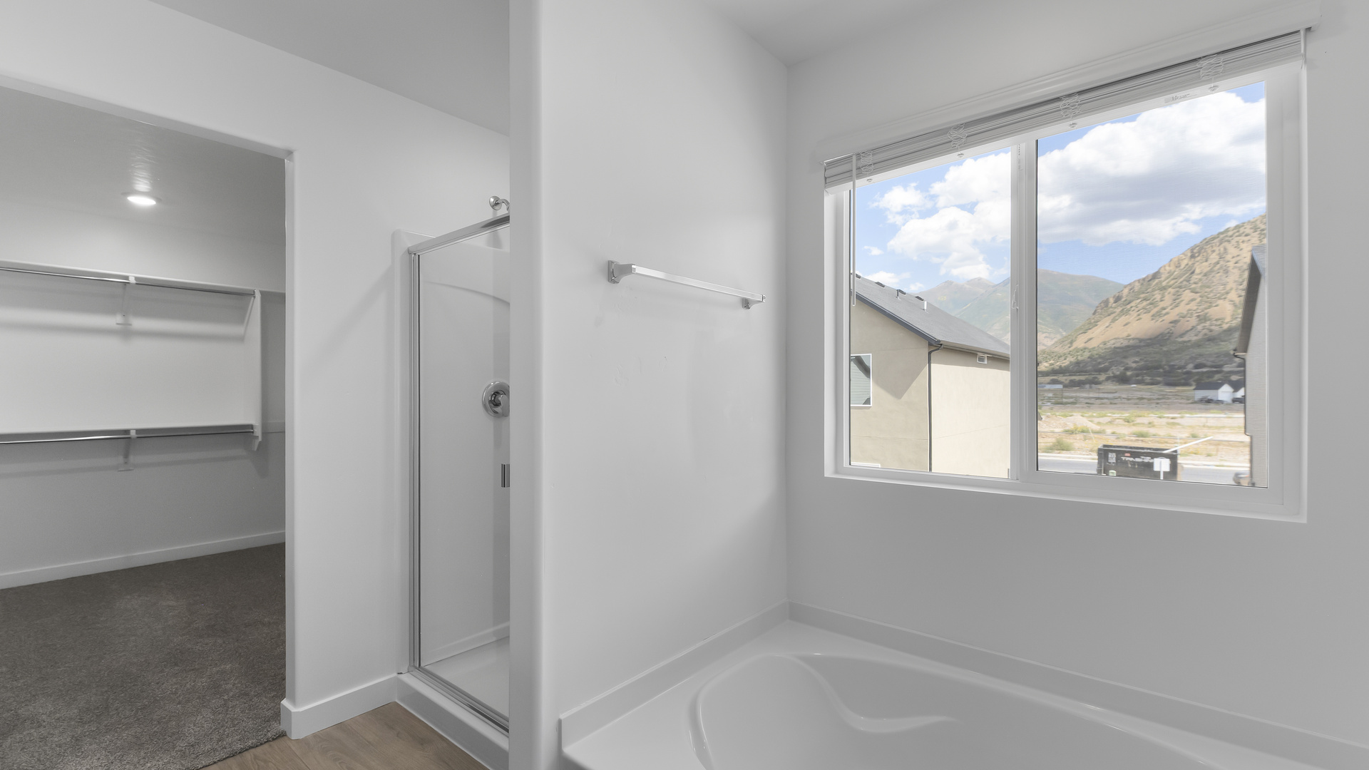 Primary bathroom with double sink vanity.
