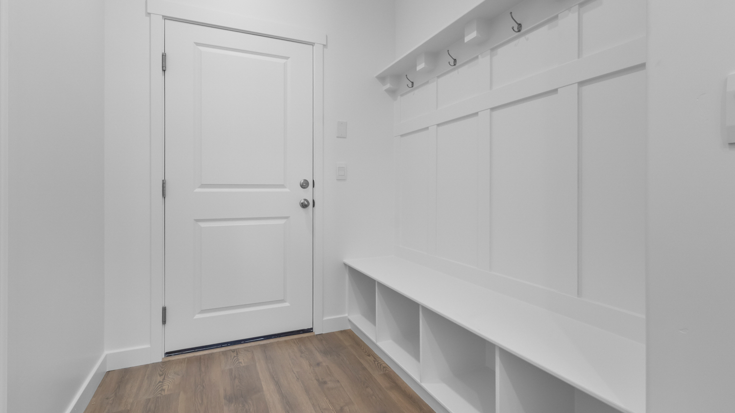 Mudroom with mudroom storage bench.
