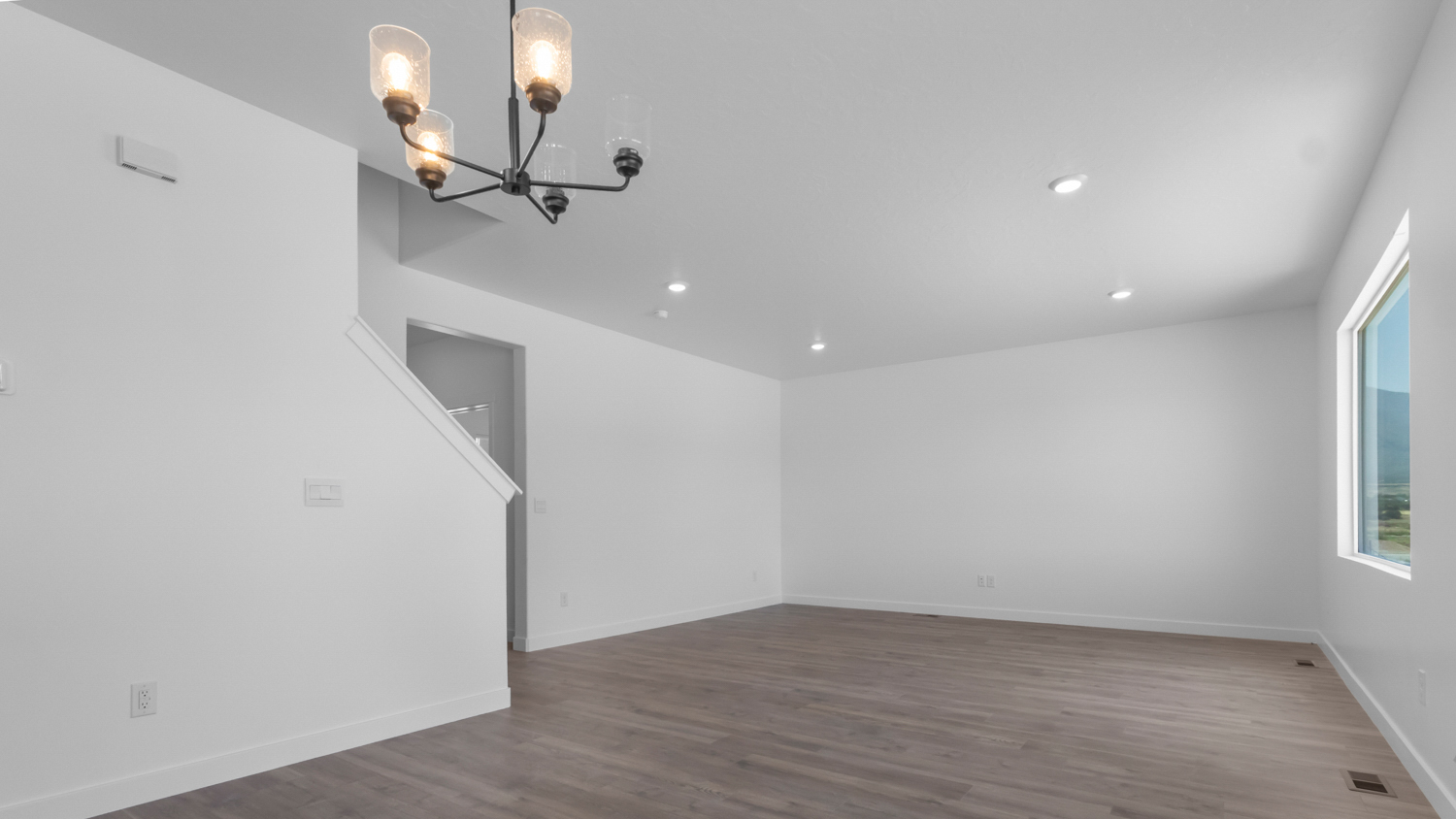 Family room wit large window.