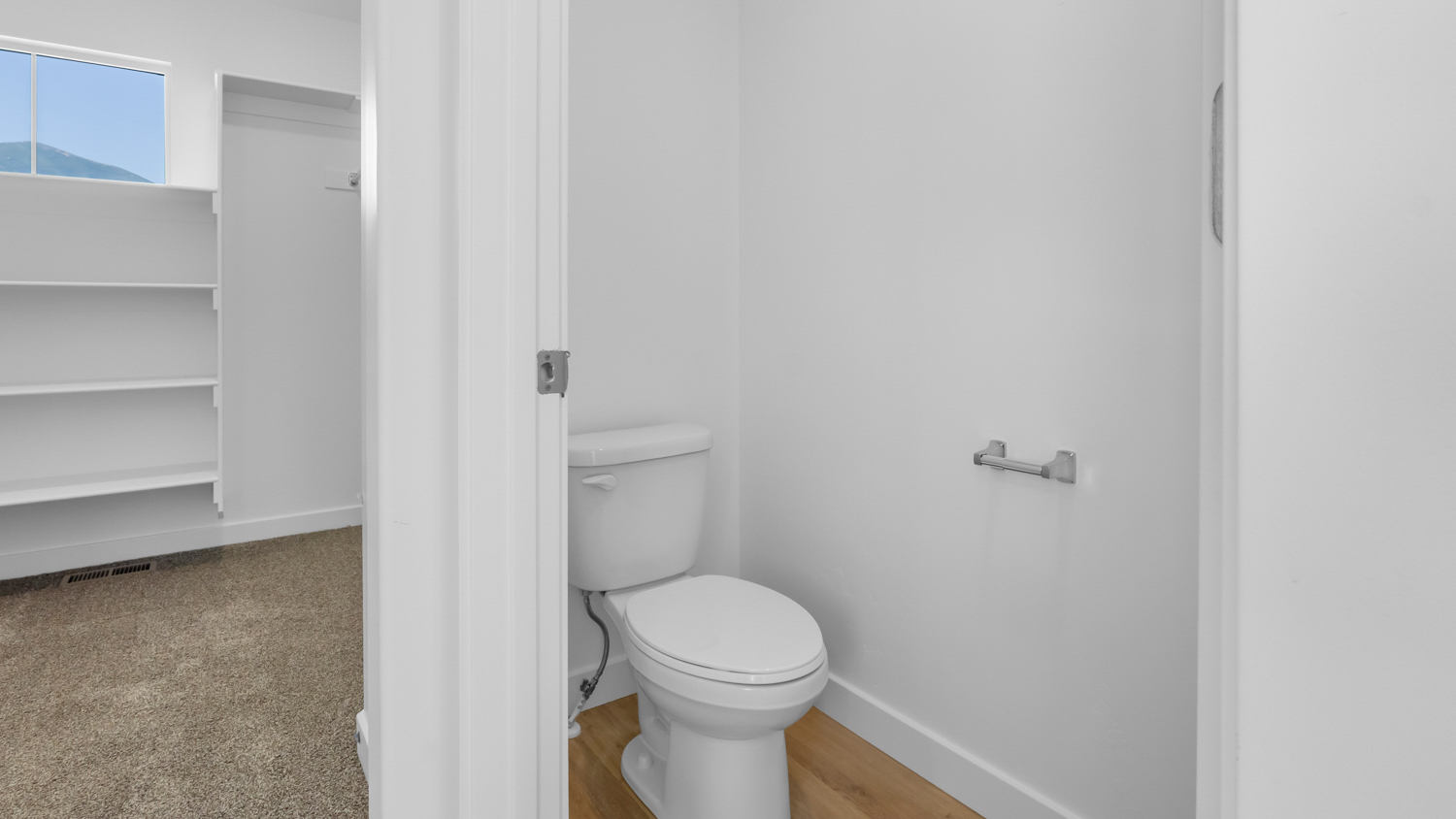 Primary bathroom with water closet.