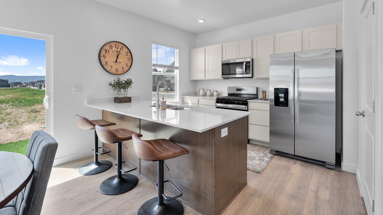 Kitchen area with patio doors and kitchen island.