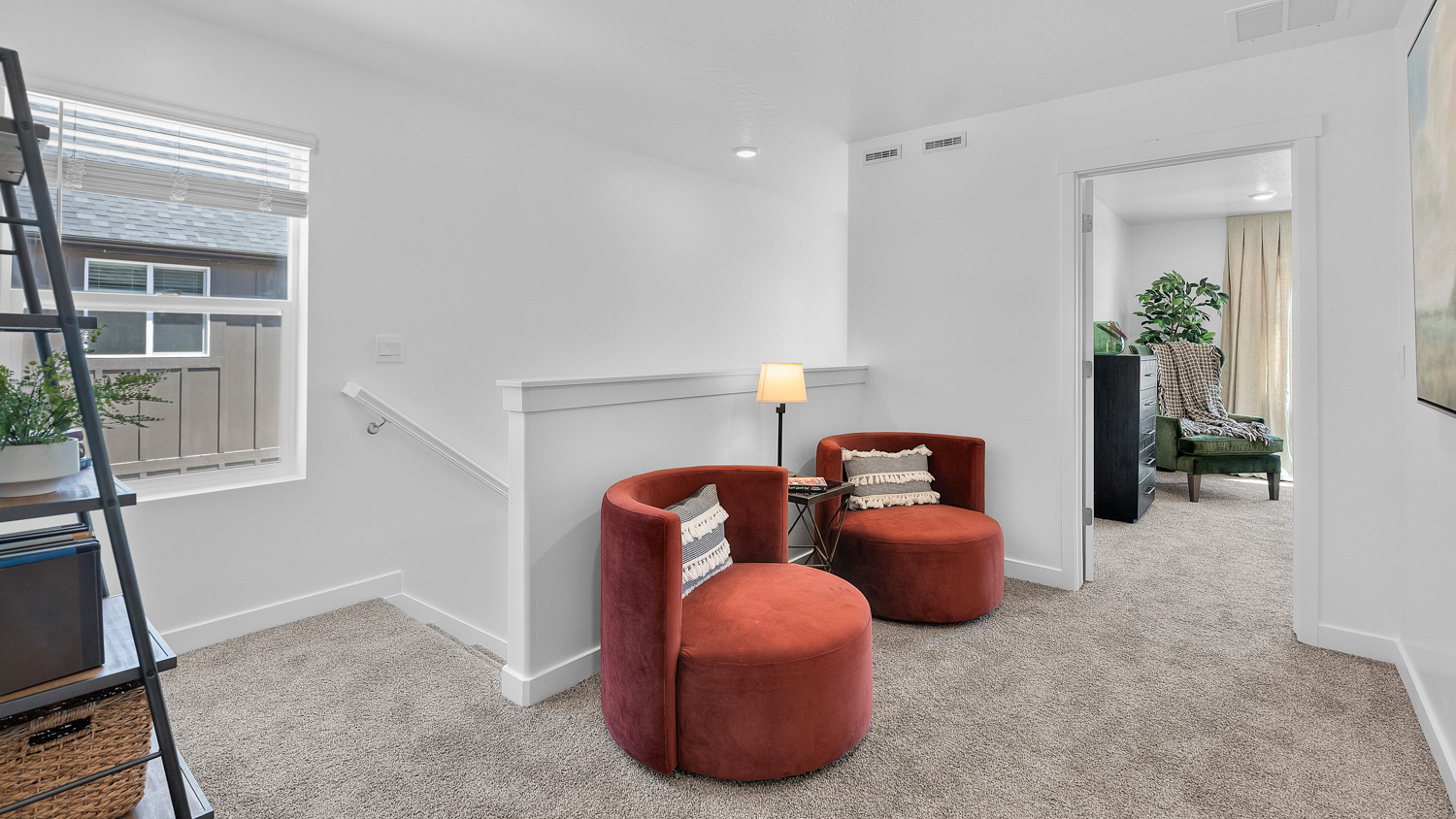 Upstairs loft space featuring window.