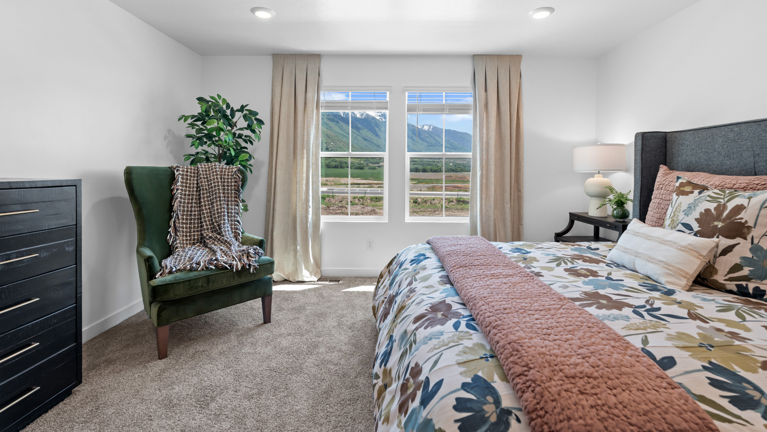 Primary bedroom with large window.
