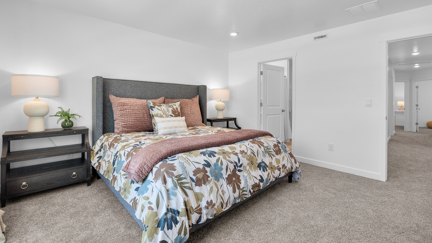 Primary bedroom with large window.