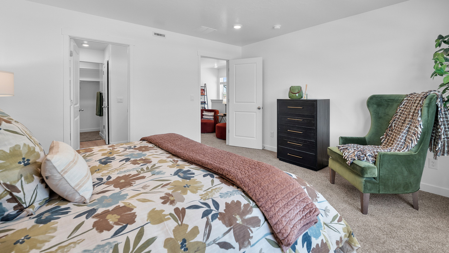 Primary bedroom with large window.