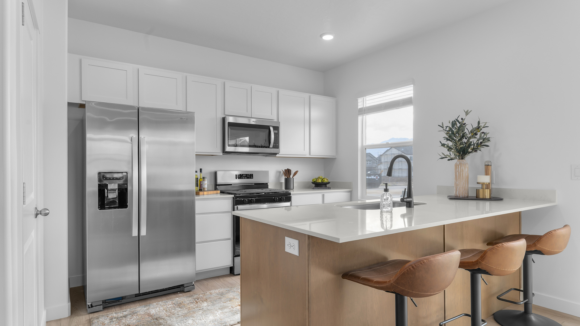 Kitchen area with patio doors and kitchen island.
