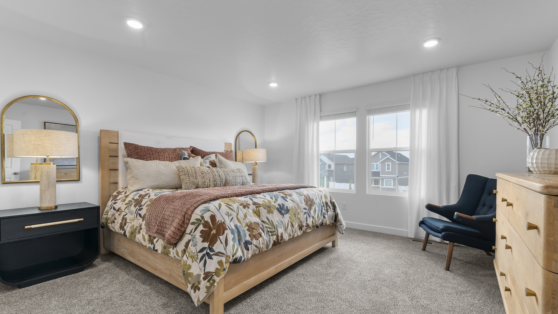 Primary bedroom with large window.