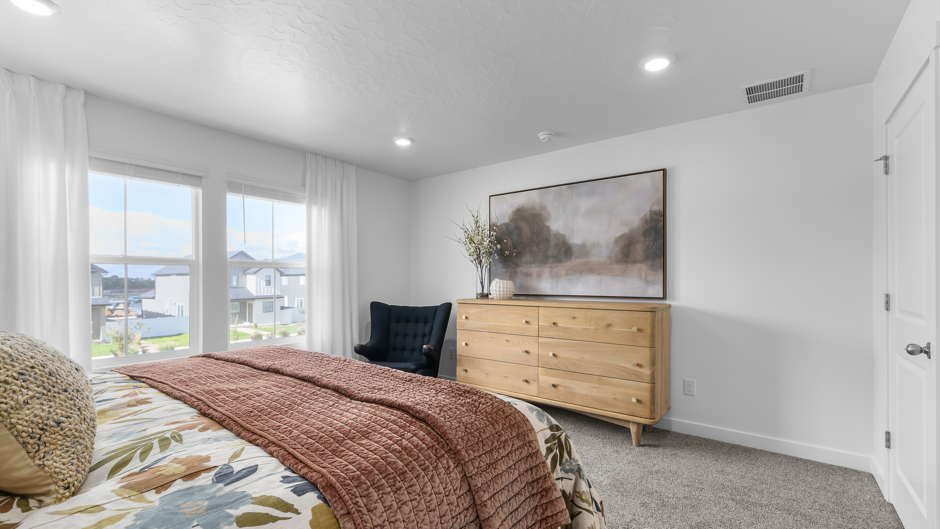 Primary bedroom with large window.