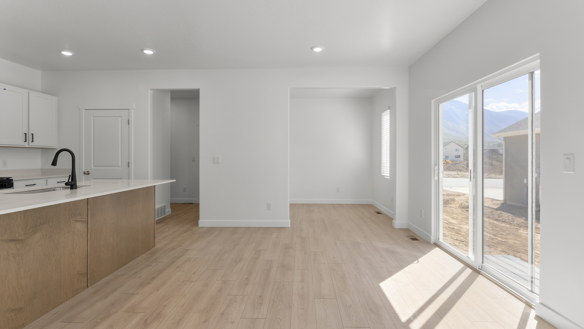 Kitchen and dining with patio doors.