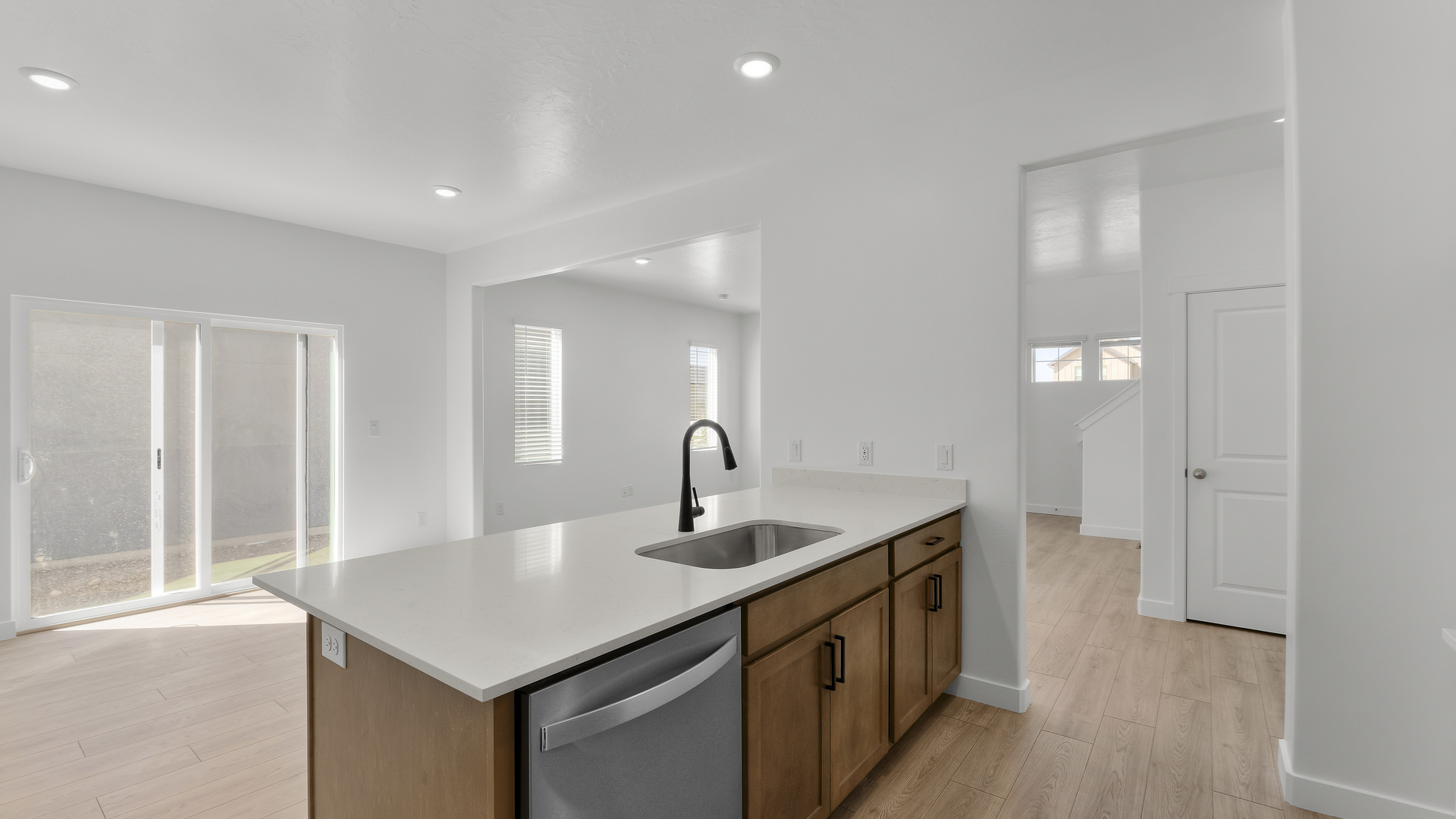 Kitchen with kitchen island and stainless steel appliances.