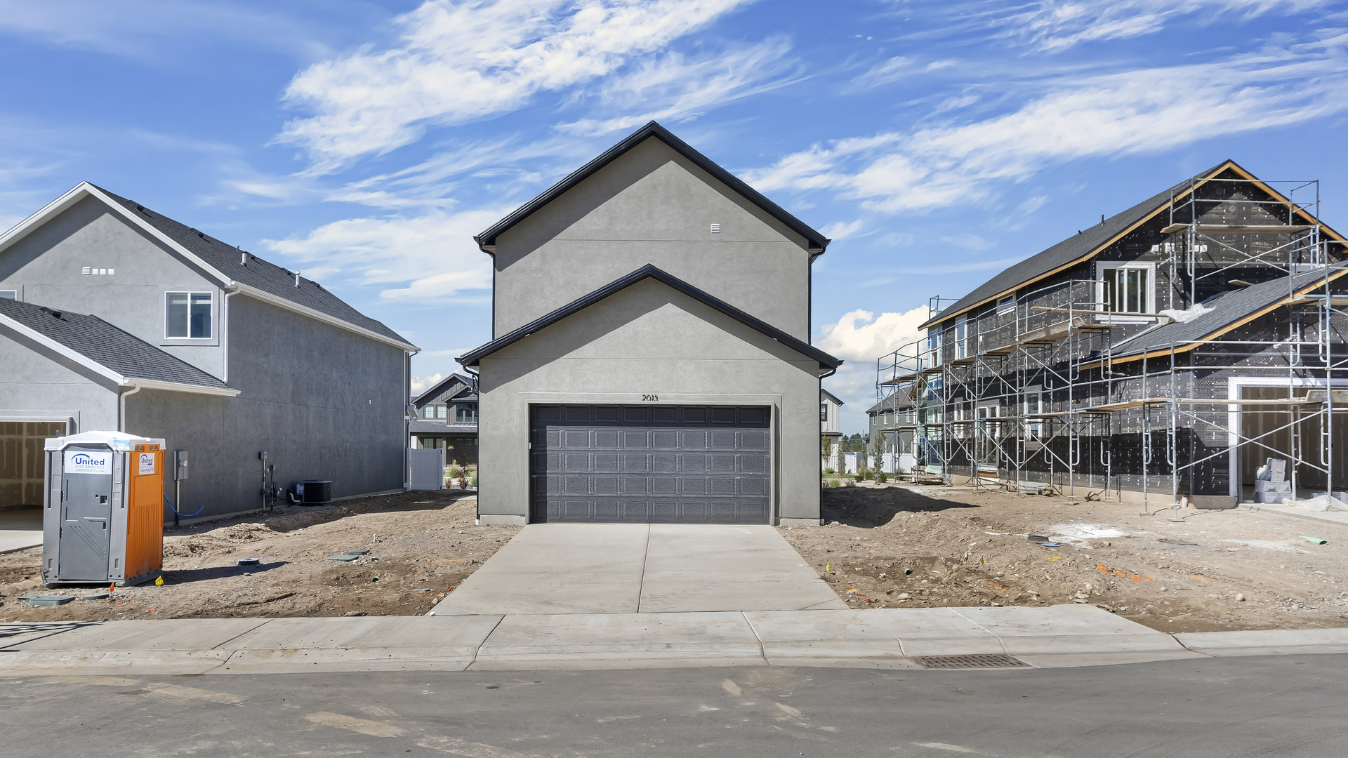 Back of home with garage.