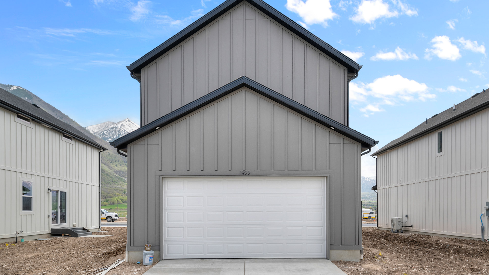 Back of home with garage.