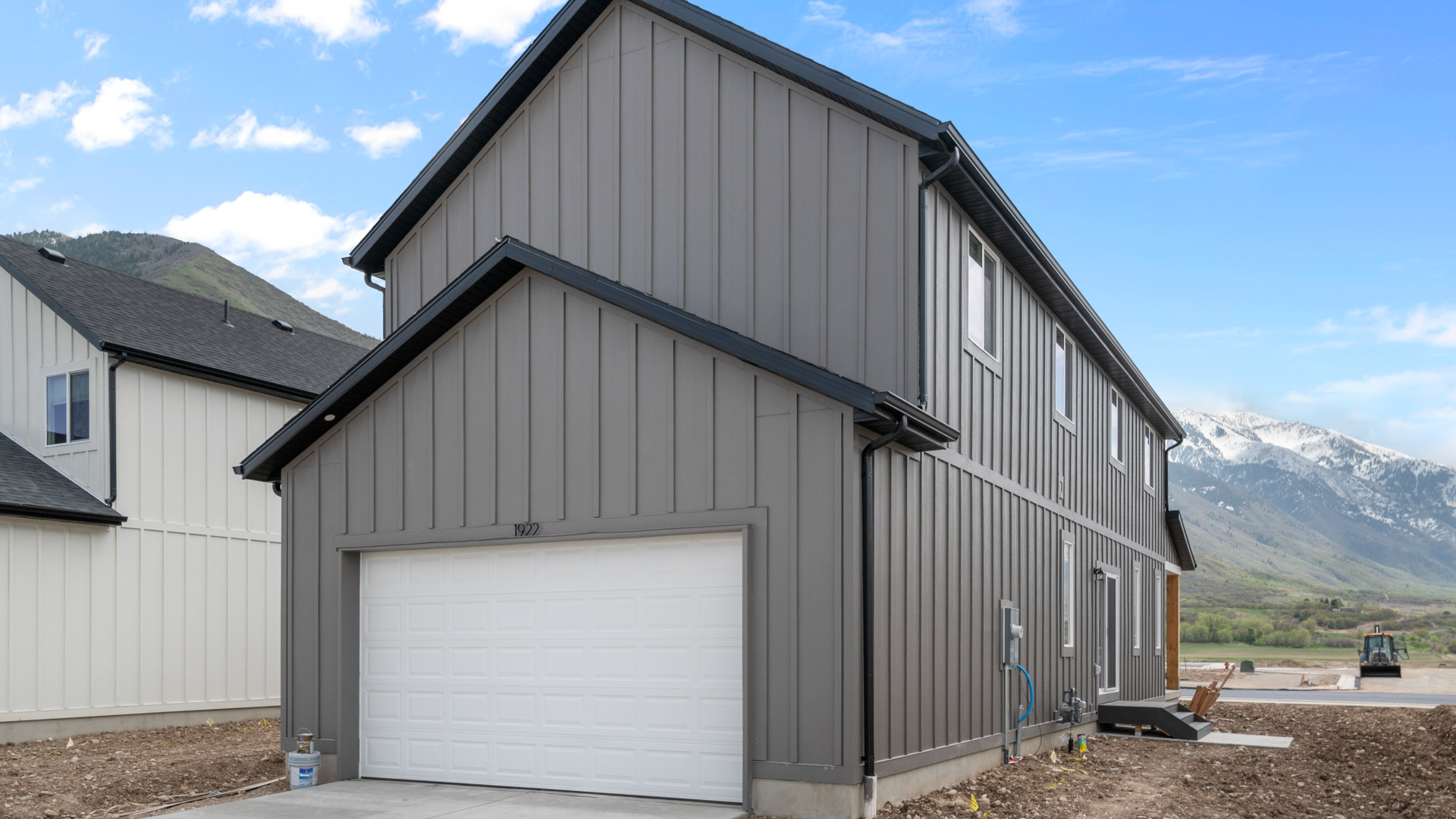 Back of home with garage.