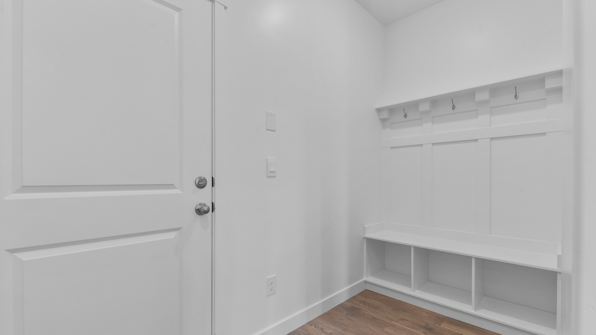 Mudroom area with storage bench.