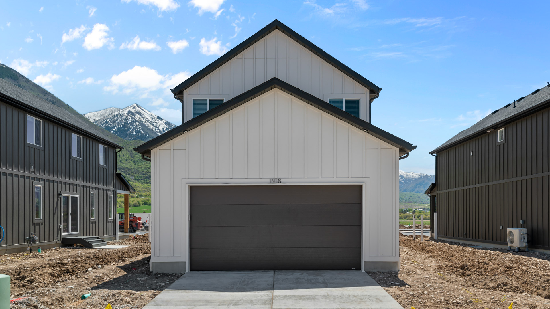 Back of home with garage.