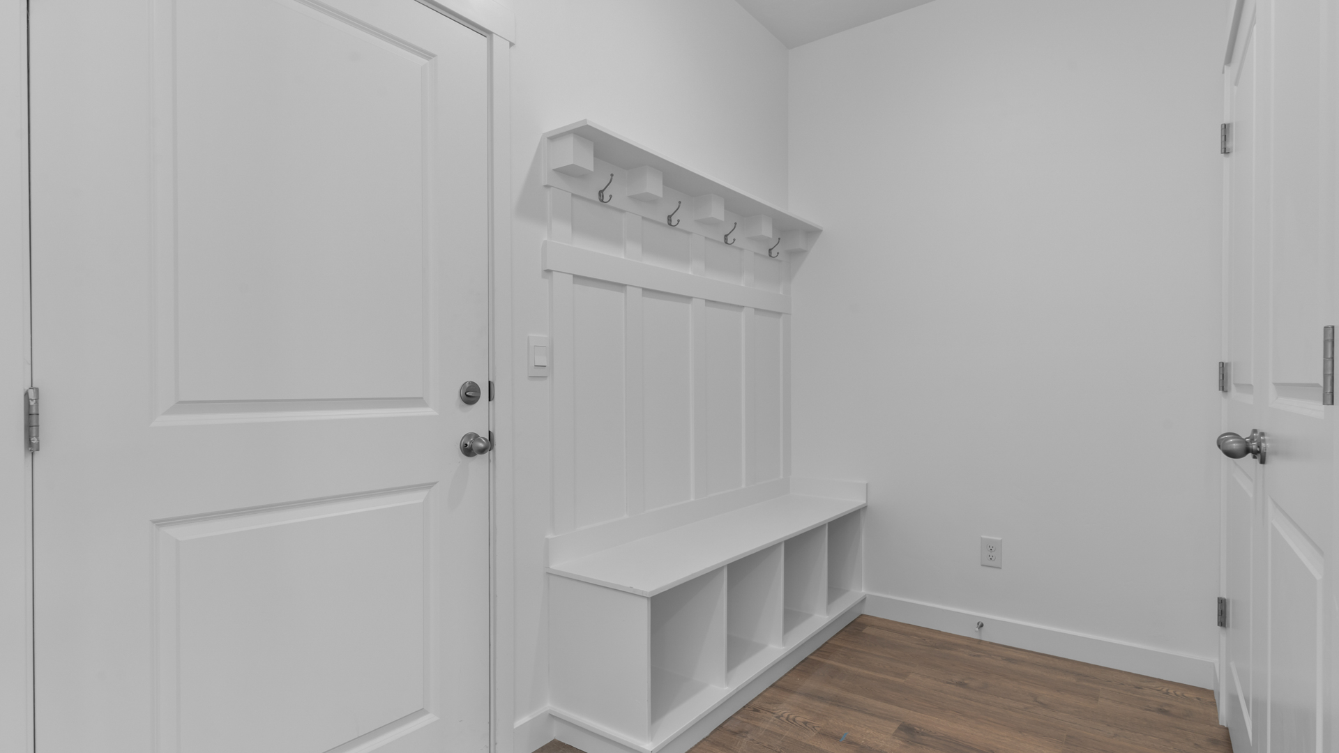 Mudroom area with mudroom storage bench.