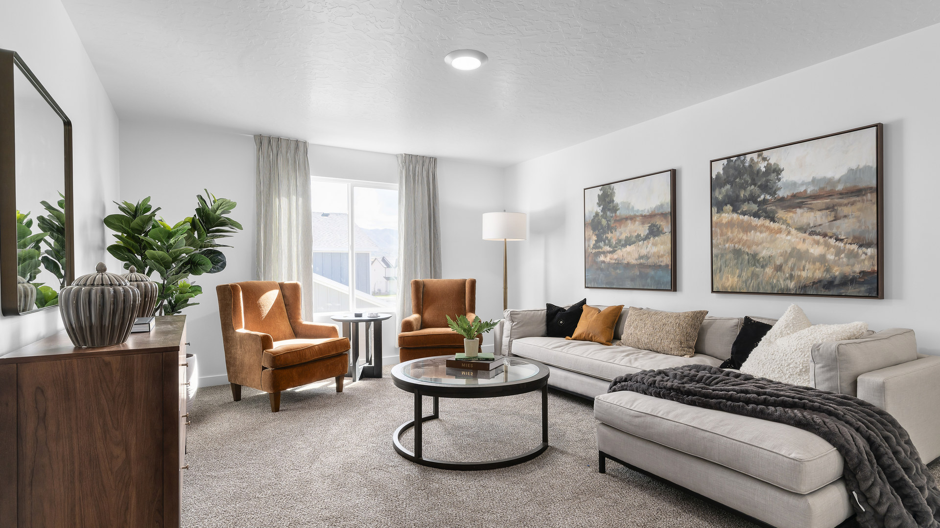 Spacious loft area at the top of the stairs on the second story with four large windows that provide ample light.