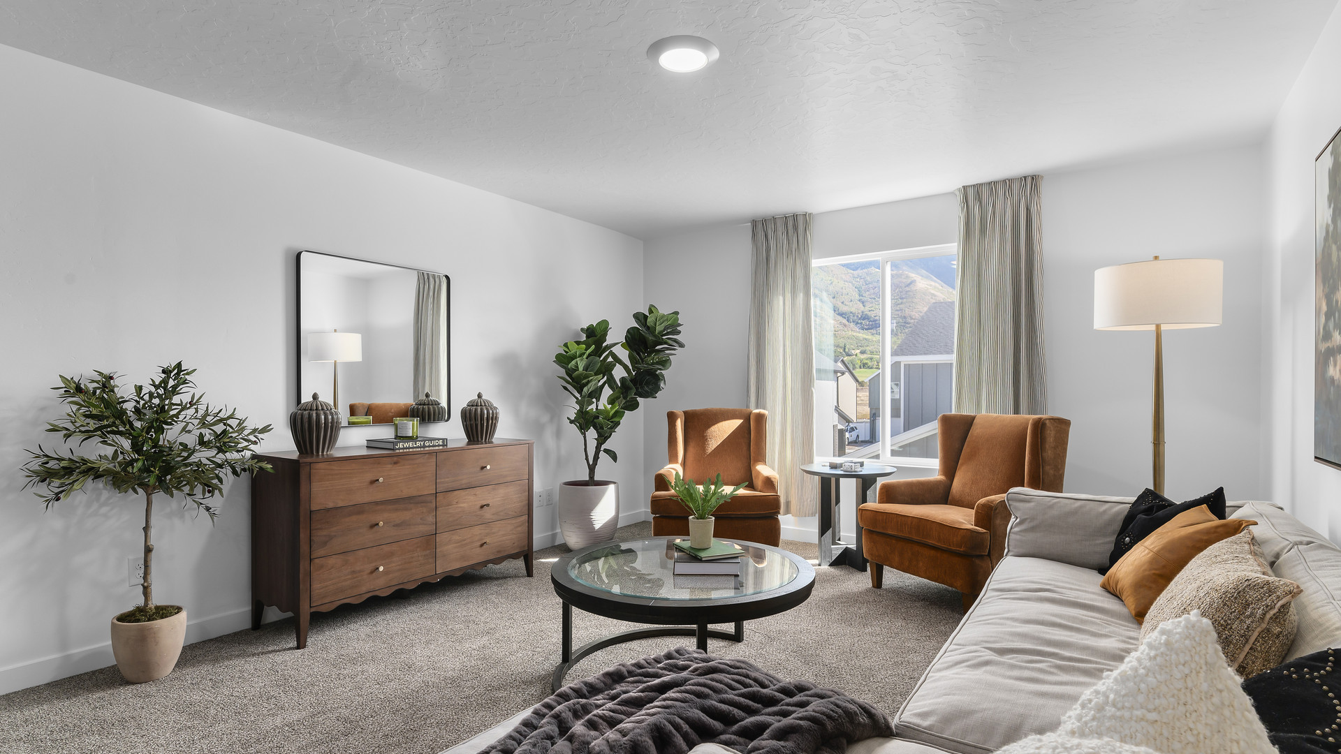 Spacious loft area at the top of the stairs on the second story with four large windows that provide ample light.