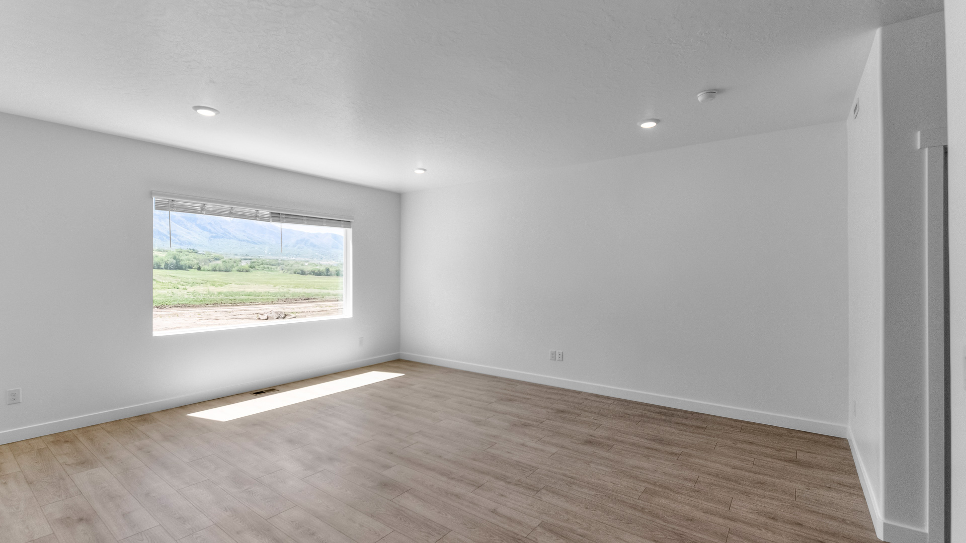 Family room with large window.