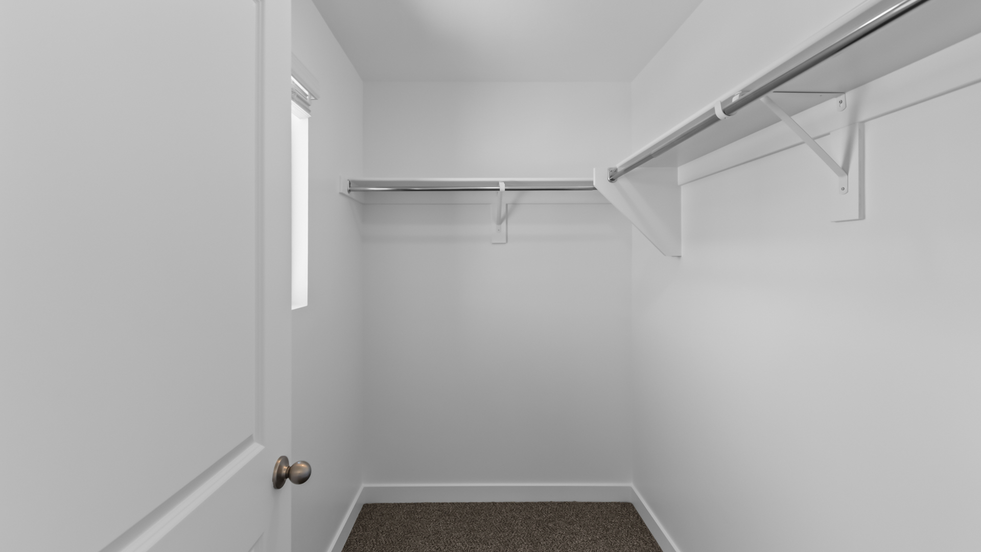 Walk-in closet with window.