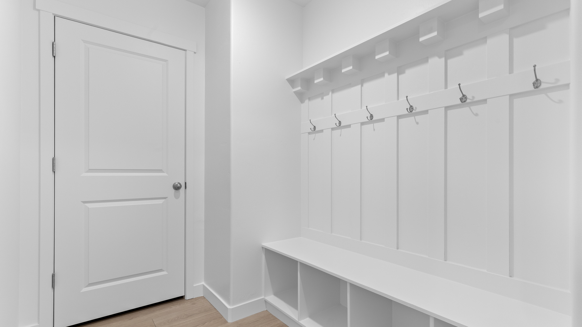 Mudroom with mudroom storage bench and hooks.