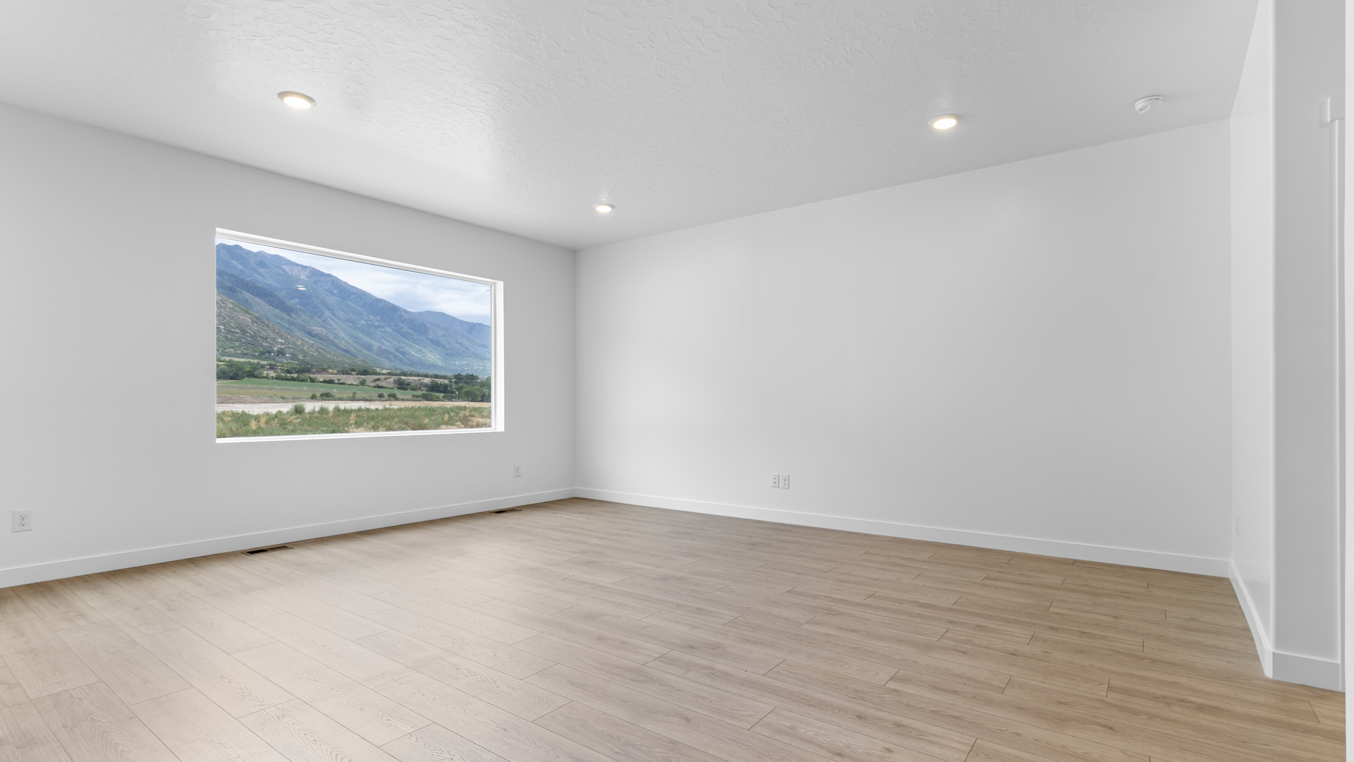 Family room with large window.