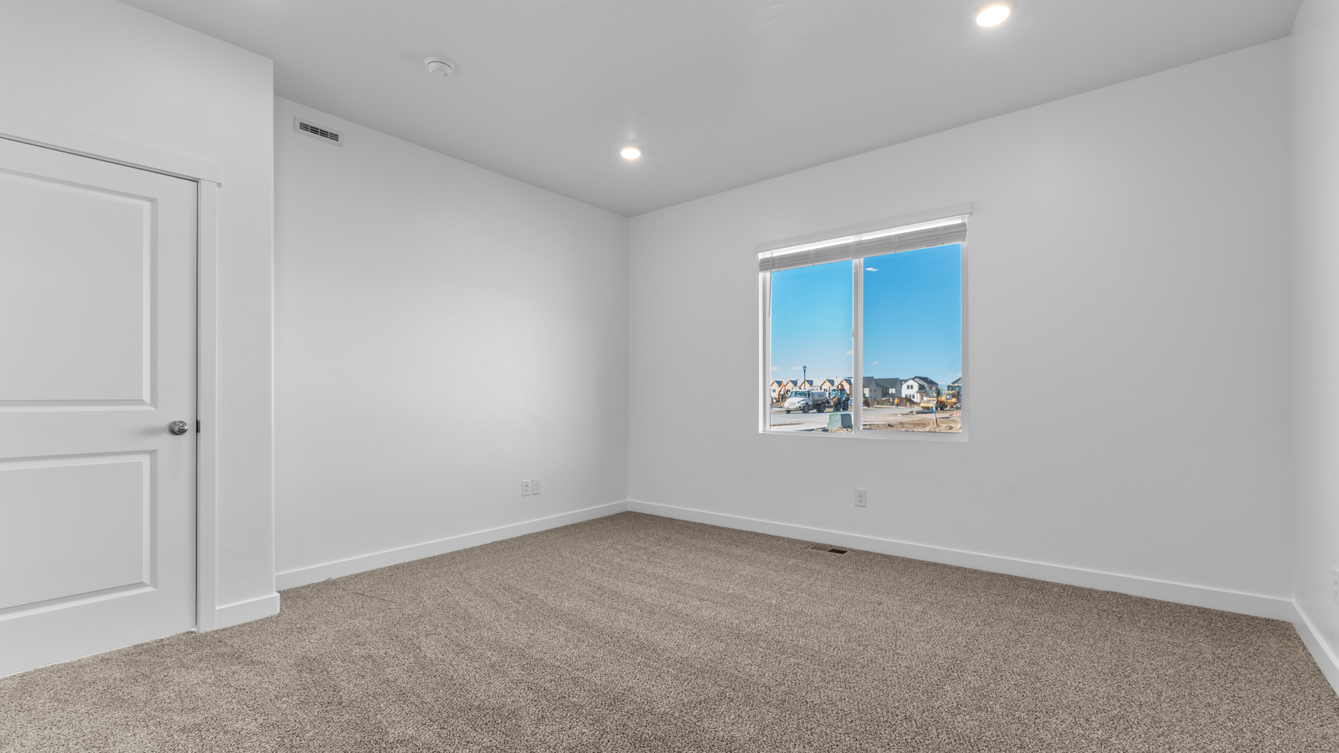Primary bedroom with window.