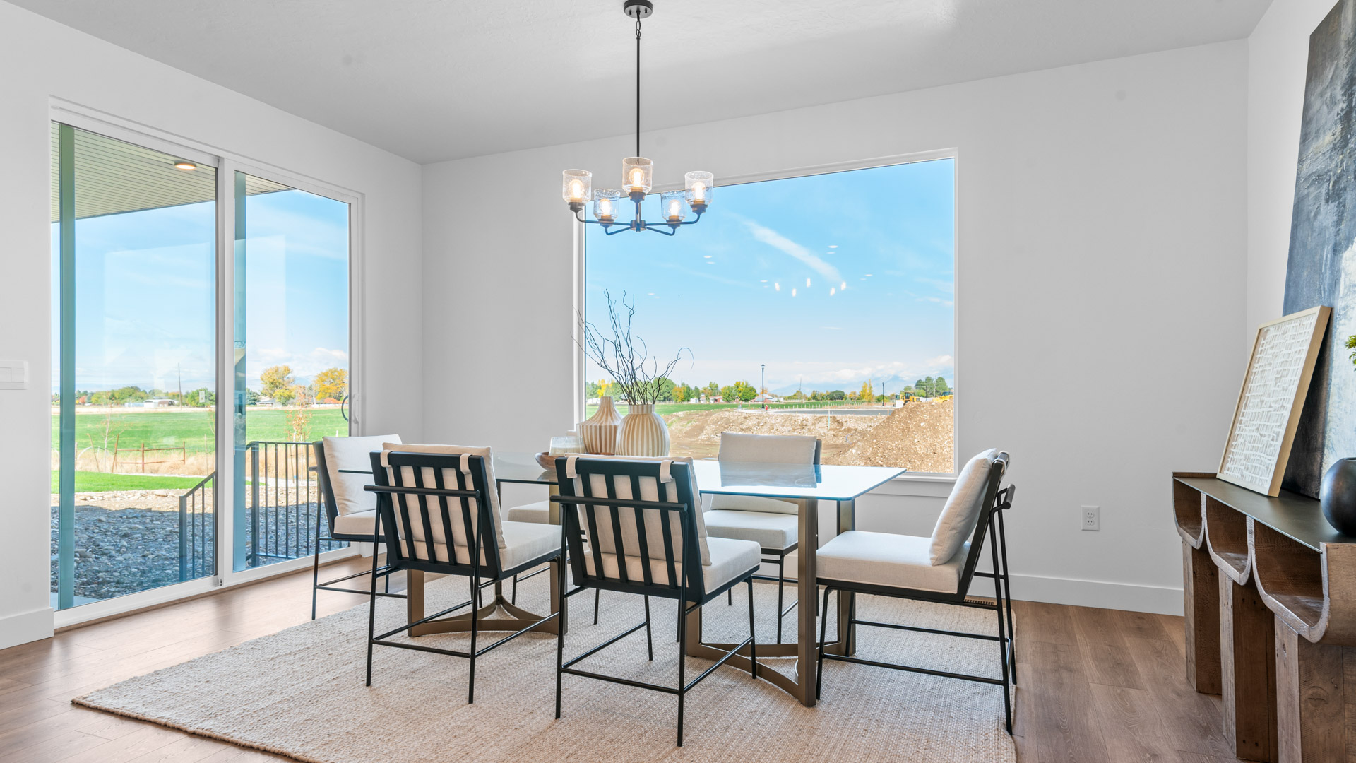 Dining room with large window and patio doors.