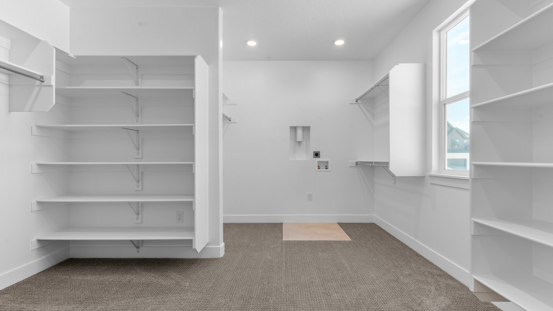 Large walk-in closet with window.