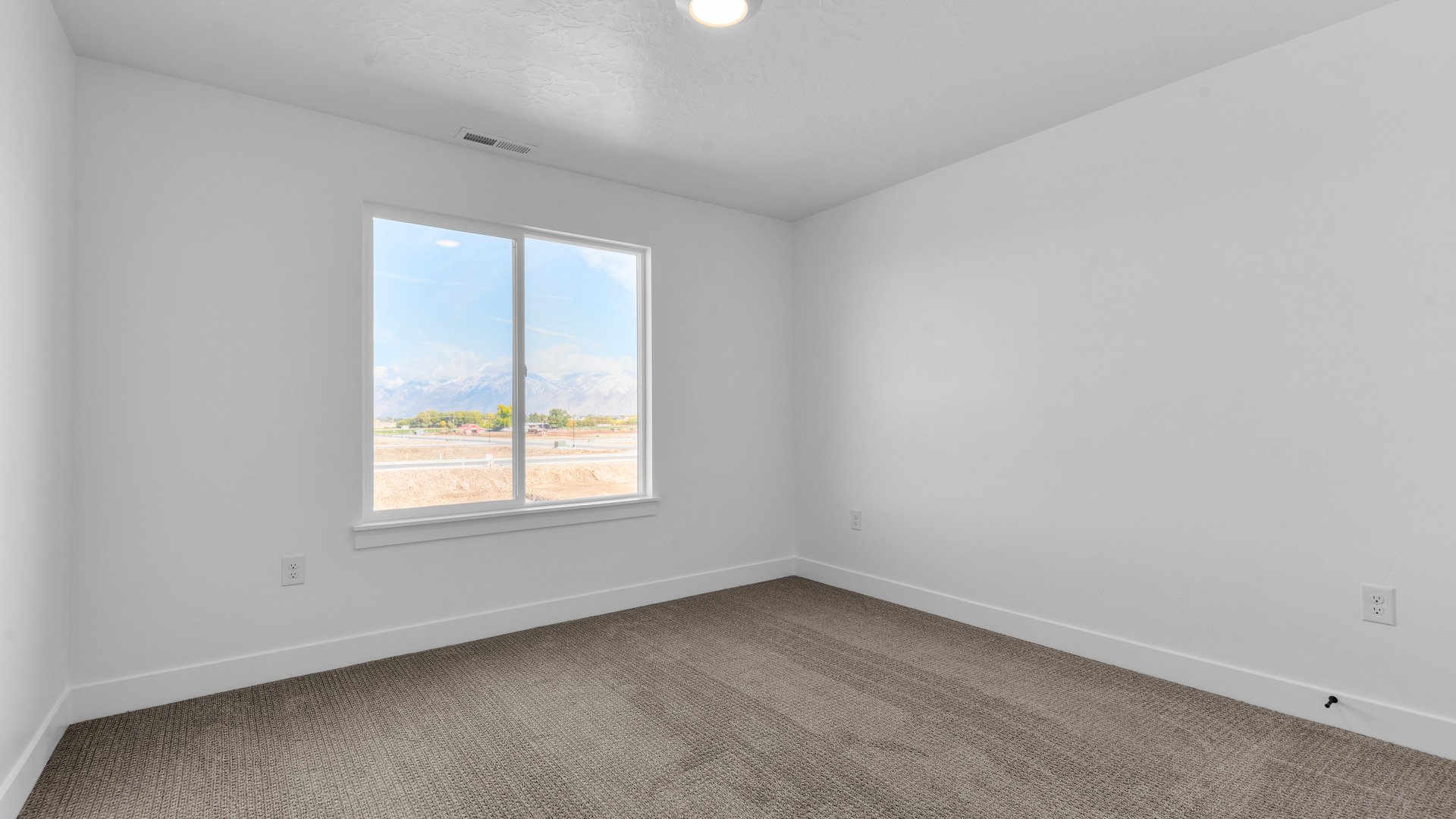 Bedroom with large window.