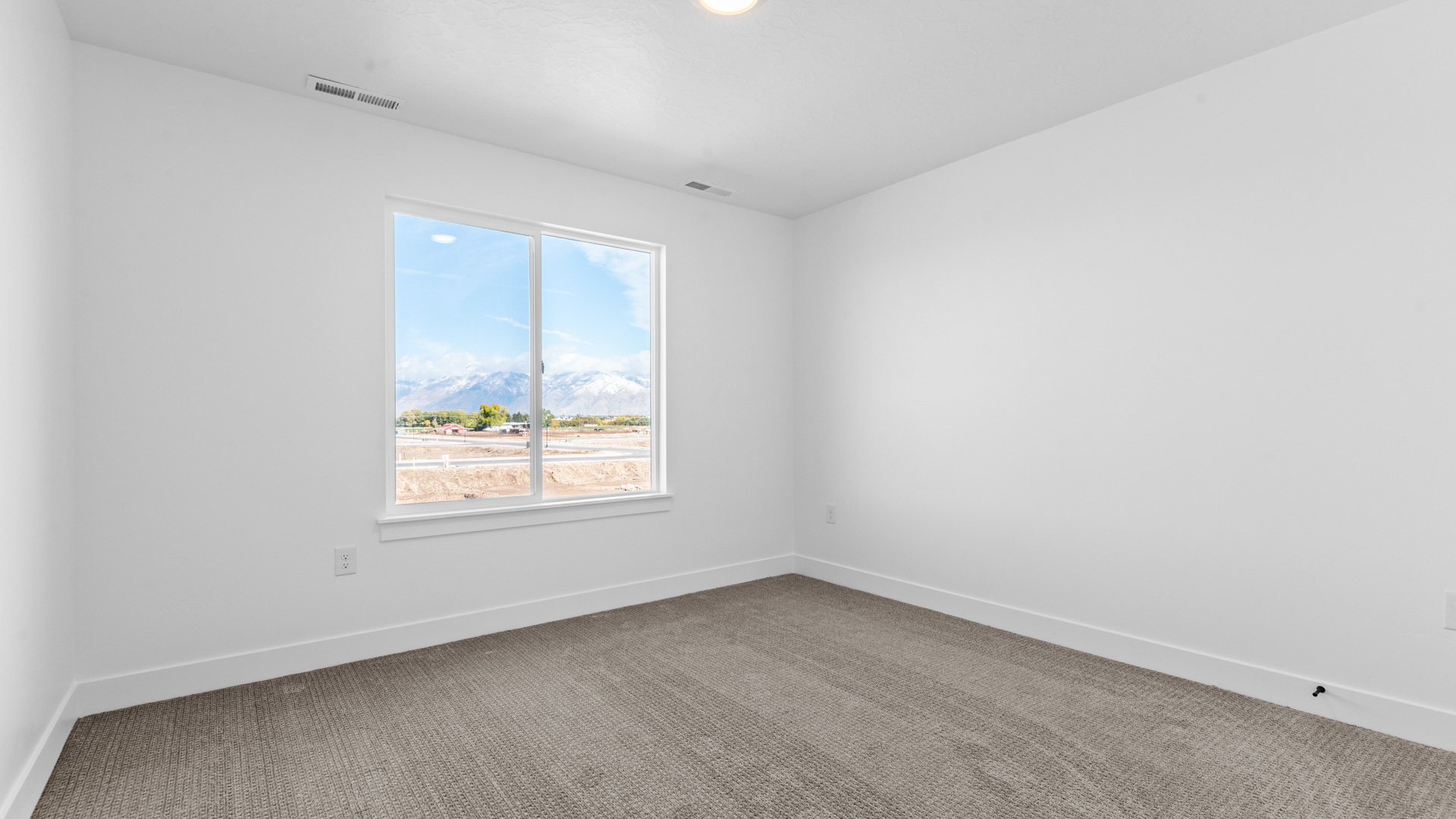 Bedroom with large window.