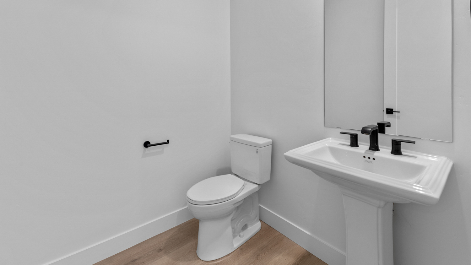 Powder bath with pedestal sink.