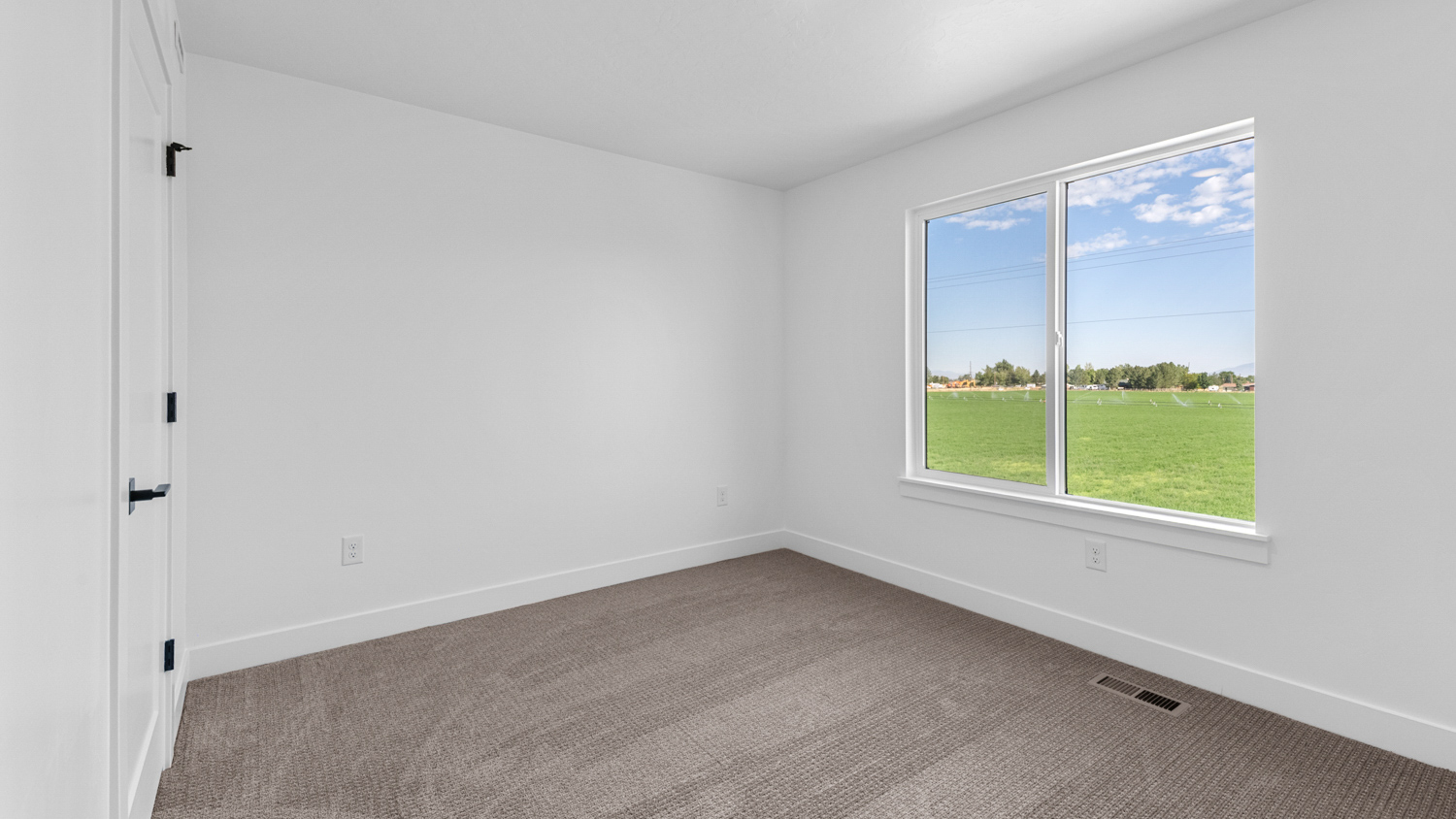 Bedroom with large window.