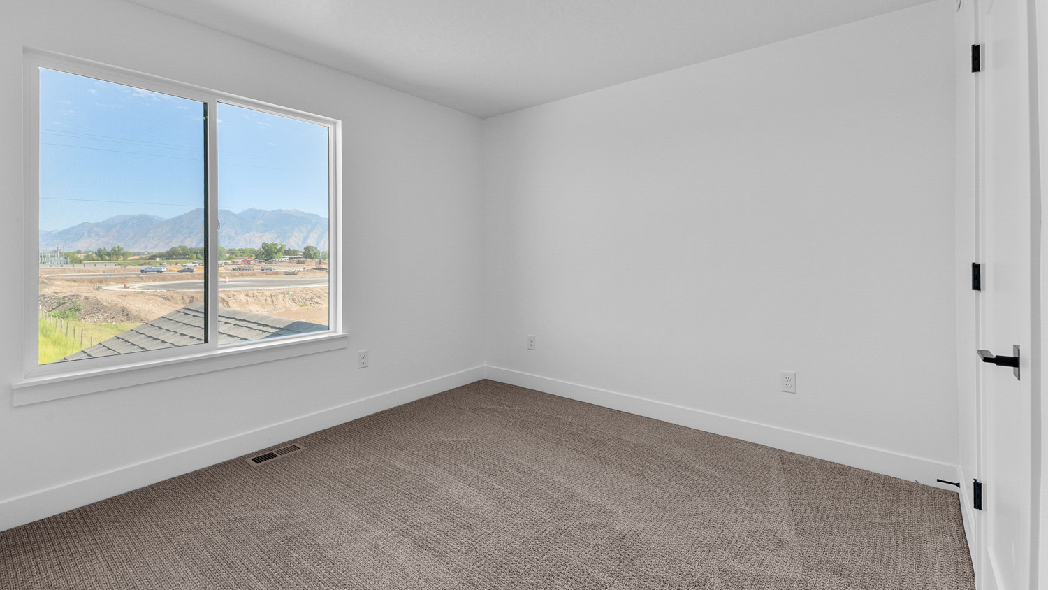 Bedroom with large window.