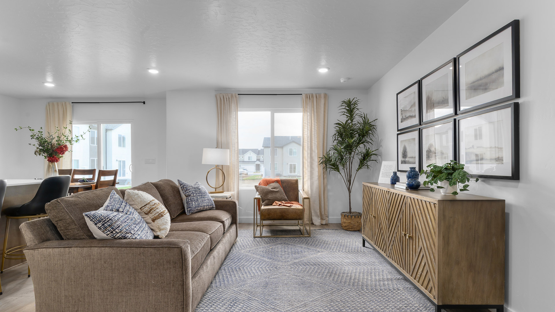 View of spacious living room with large window.