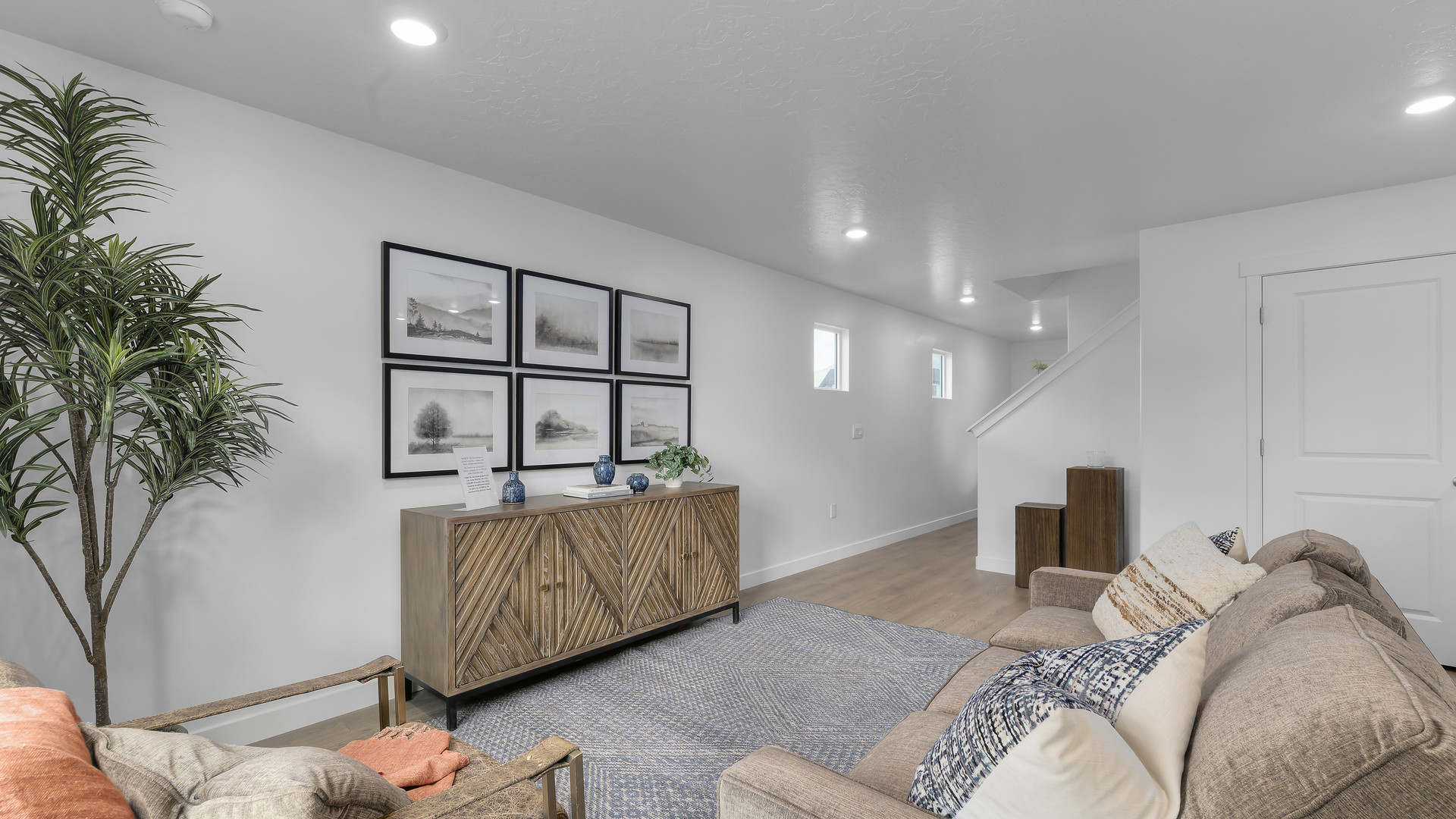 View of spacious living room with large window.