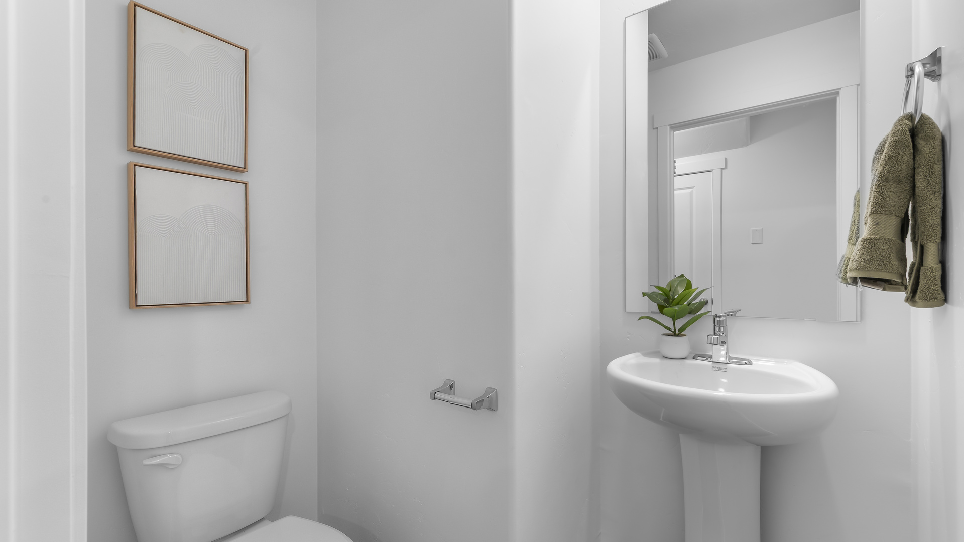 Powder bathroom with pedestal sink.