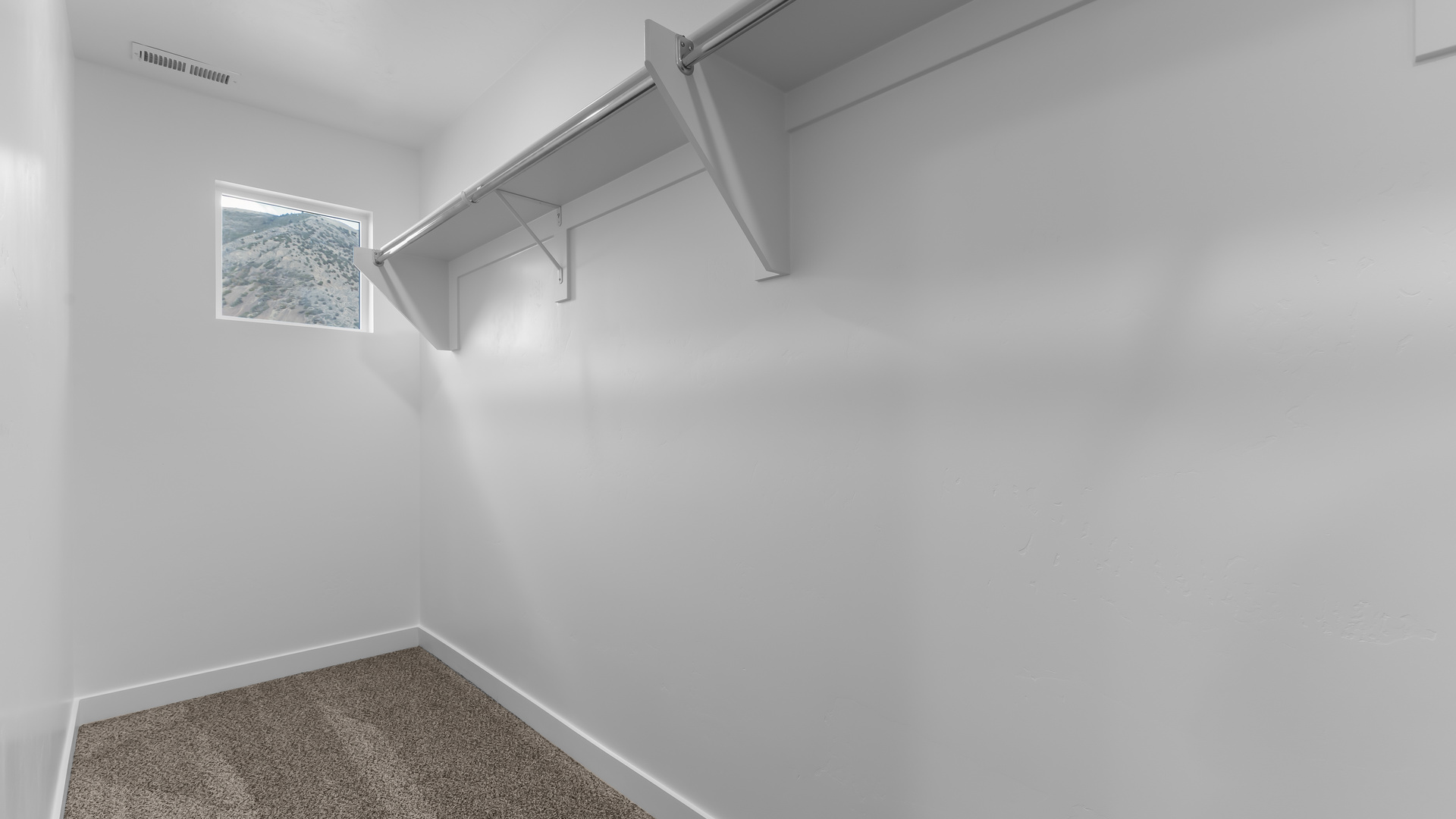 Spacious walk-in closet off the bathroom.