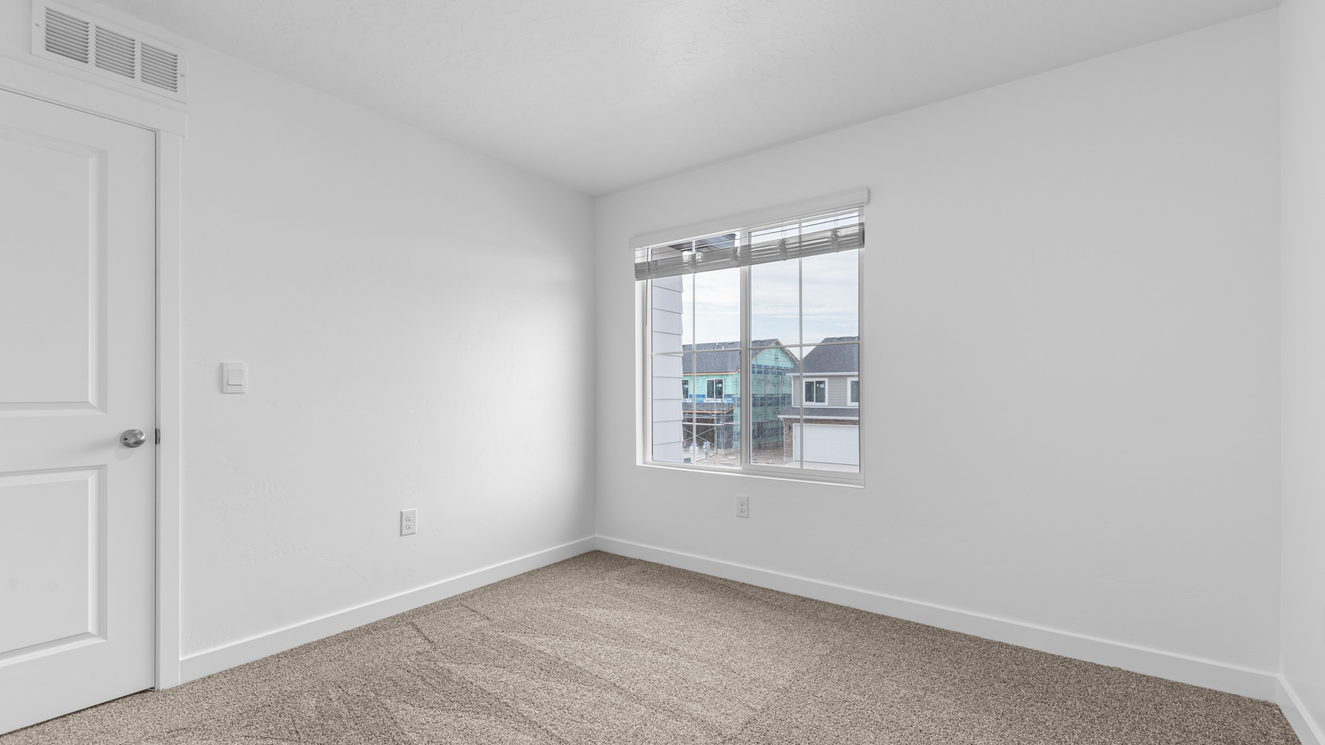 Bedroom with large window.